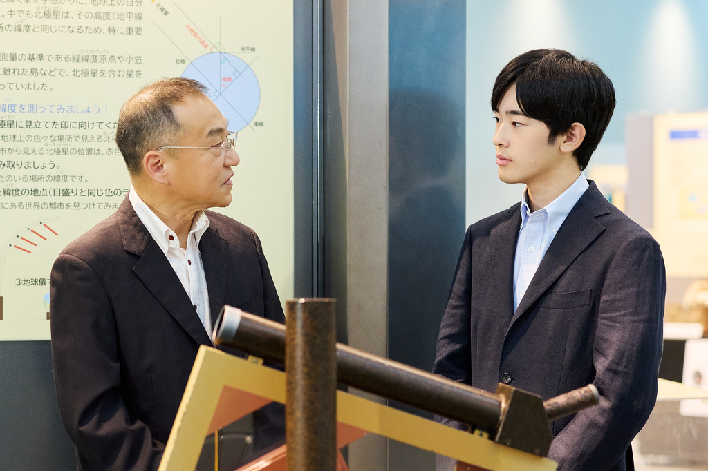 In this photo provided by the Imperial Household Agency of Japan, Japan's Prince Hisahito, right, visits the Science Museum of Map and Survey in Tsukuba, Ibaraki prefecture, Japan, on Aug. 13, 2026, ahead of his 20th birthday on Sept. 6, 2026. (The Imperial Household Agency of Japan via AP)