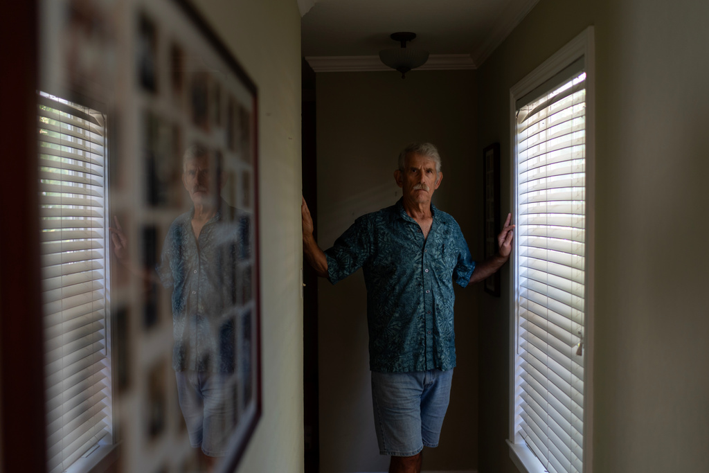 Christy Morrill, 72, who lost decades of memories to autoimmune encephalitis, poses for a photo at his home, Wednesday, Aug. 20, 2025, in San Carlos, Calif. (AP Photo/David Goldman)
