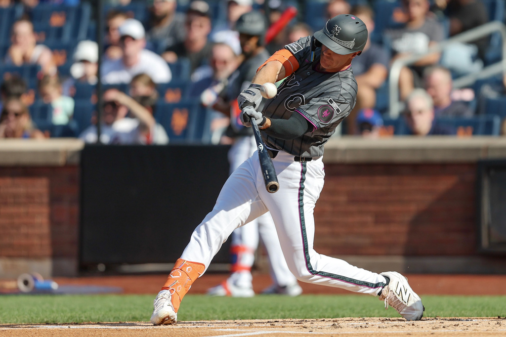 New York Mets' Jared Young connects on a double during the first inning of a baseball game against the Washington Nationals, Saturday, Aug. 15, 2026, in New York. (AP Photo/Heather Khalifa)