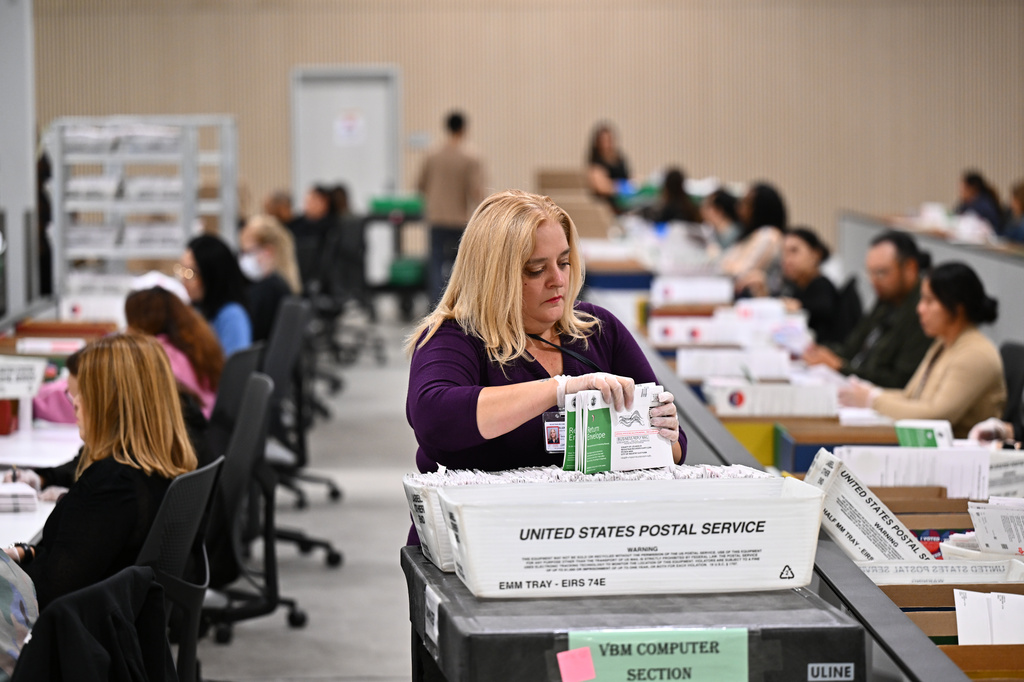 FILE - A worker sorts ballots at the L.A. County Ballot Processing Center during the California primary election, June 2, 2026, in City of Industry, Calif. (AP Photo/William Liang, File)