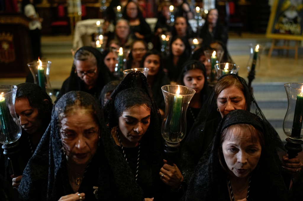 Catholics take part in a Holy Week procession in Panama City's Casco Viejo, Tuesday, March 31, 2026. (AP Photo/Matias Delacroix)