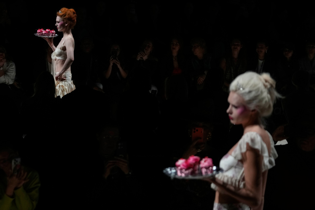 Models wear creations by Russian brand Masterpeace on a runway at the Moscow Fashion Week in Moscow, Saturday, March 14, 2026. (AP Photo/Pavel Bednyakov)