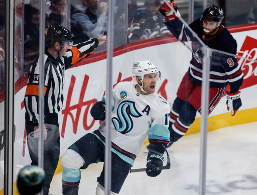 Seattle Kraken's Jaden Schwartz (17) celebrates his goal against the Winnipeg Jets during second period NHL action in Winnipeg on Thursday, October 23, 2025. (John Woods/The Canadian Press via AP) Seattle Kraken's Jaden Schwartz (17) celebrates his goal against the Winnipeg Jets during second period NHL action in Winnipeg on Thursday, October 23, 2025. (John Woods/The Canadian Press via AP)