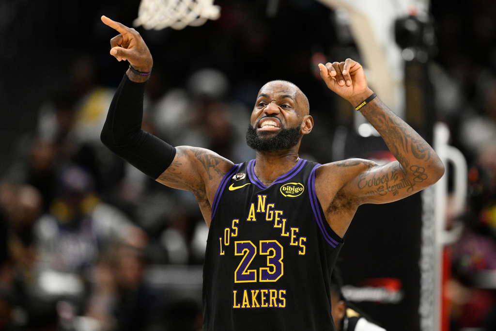 Los Angeles Lakers forward LeBron James gestures during the first half of an NBA basketball game against the Washington Wizards, Friday, Jan. 30, 2026, in Washington. (AP Photo/Nick Wass)