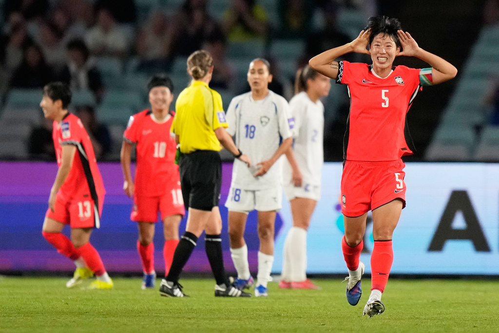South Korea's Ko Yoo-jin celebrates after scoring her team's second goal during the Women's Asian Cup quarterfinal soccer match between South Korea and Uzbekistan in Sydney, Saturday, March 14, 2026. (AP Photo/Rick Rycroft)