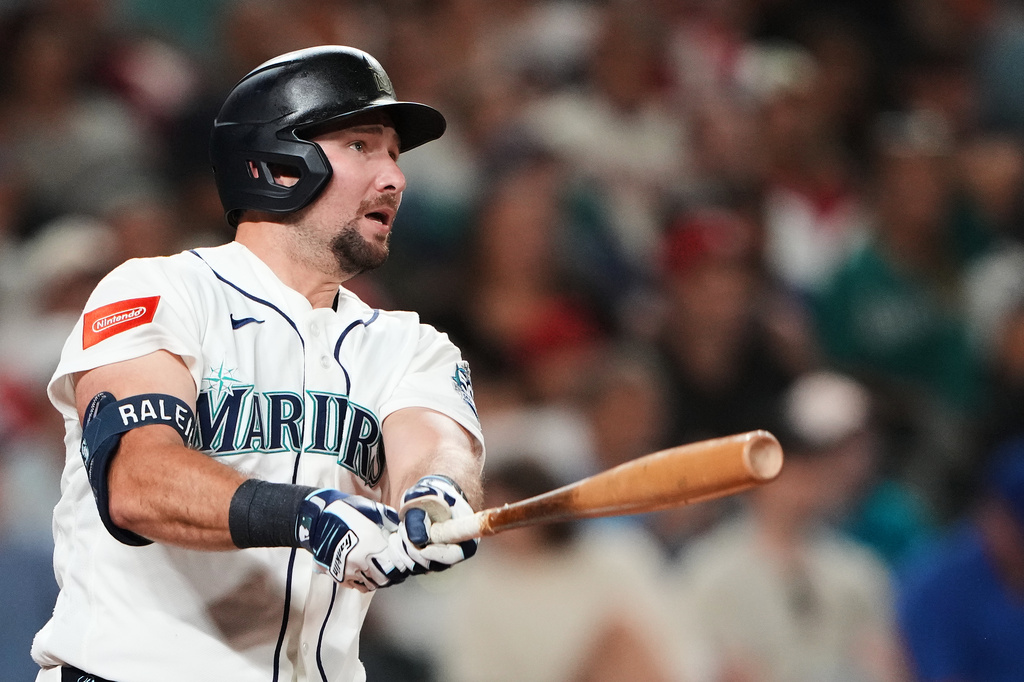 Seattle Mariners' Cal Raleigh follows through on a solo home run against the Philadelphia Phillies during the seventh inning of a baseball game, Monday, Aug. 24, 2026, in Seattle. (AP Photo/Lindsey Wasson)
