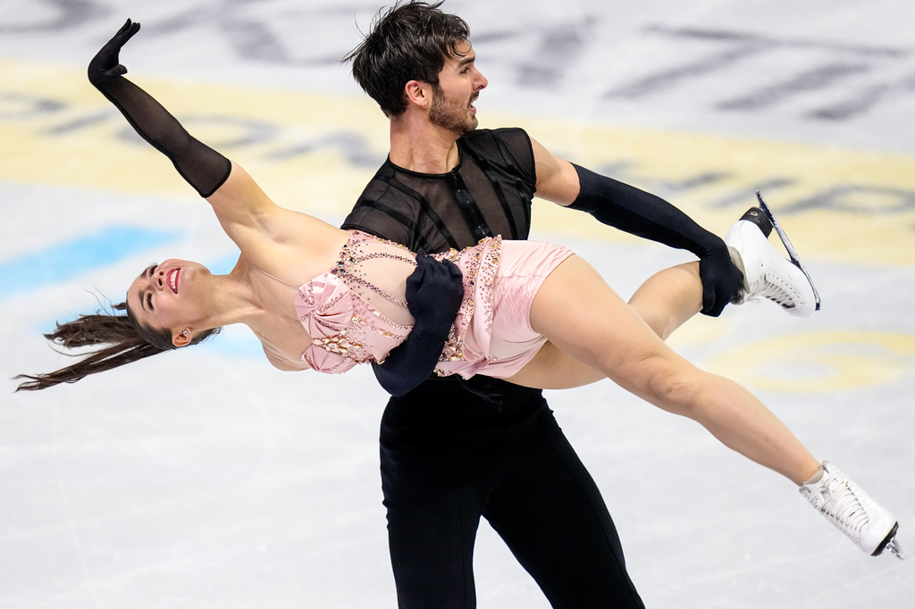 Laurence Fournier Beaudry and Guillaume Cizeron from France perform during the ice dance rhythm dance at the Figure Skating World Championships in Prague, Czech Republic, Friday, March 27, 2026. (AP Photo/Petr David Josek)