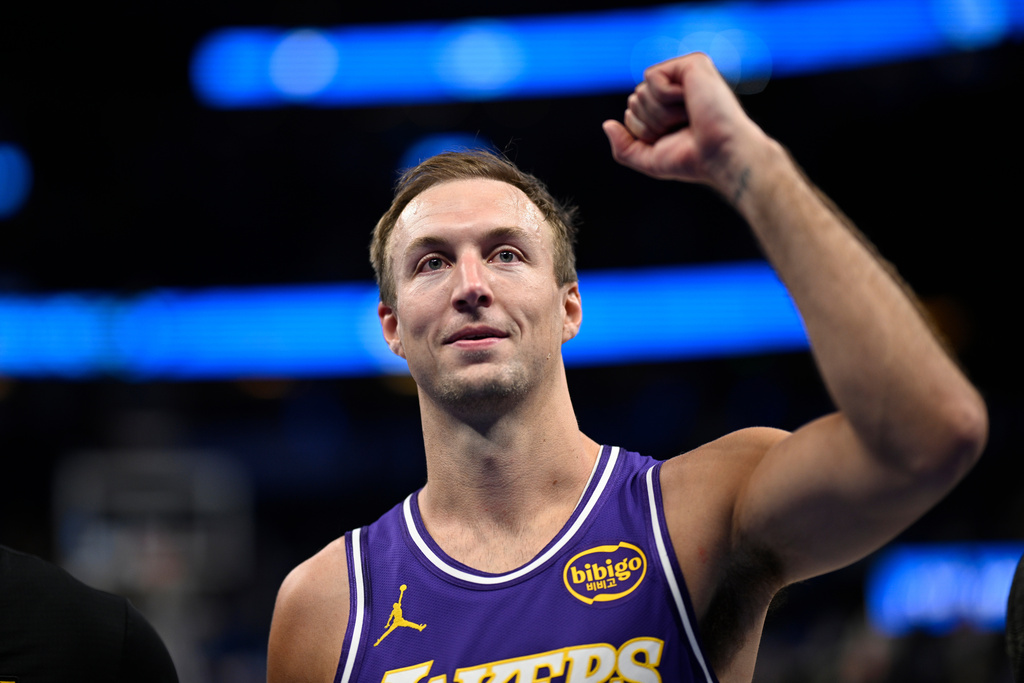 Los Angeles Lakers guard Luke Kennard reacts while leaving the court after making the winning basket in an NBA basketball game against the Orlando Magic, Saturday, March 21, 2026, in Orlando, Fla. (AP Photo/Phelan M. Ebenhack)