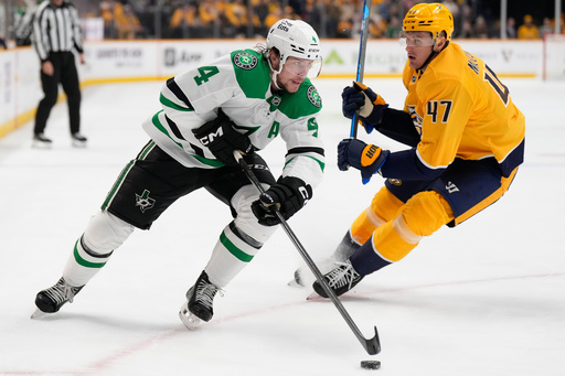 Dallas Stars defenseman Miro Heiskanen (4) skates the puck past Nashville Predators right wing Michael McCarron (47) during the first period of an NHL hockey game Sunday, Oct. 26, 2025, in Nashville, Tenn. (AP Photo/George Walker IV) Dallas Stars defenseman Miro Heiskanen (4) skates the puck past Nashville Predators right wing Michael McCarron (47) during the first period of an NHL hockey game Sunday, Oct. 26, 2025, in Nashville, Tenn. (AP Photo/George Walker IV)