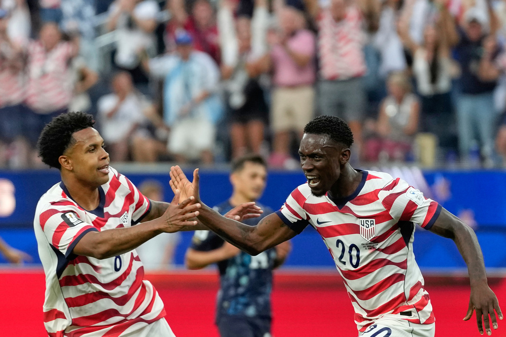 United States' Folarin Balogun (20) celebrates scoring his side's second goal against Paraguay during the World Cup Group D soccer match in Inglewood, Calif., near Los Angeles, Friday, June 12, 2026. (AP Photo/Andre Penner)