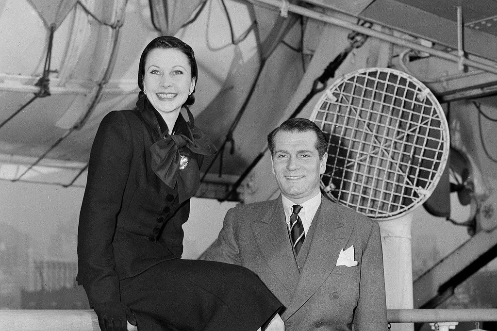 FILE - Actors Vivien Leigh, left, and Laurence Olivier arrive in New York aboard the ocean liner Mauritania, Dec. 6, 1951. (AP Photo/Tom Fitzsimmons, File)