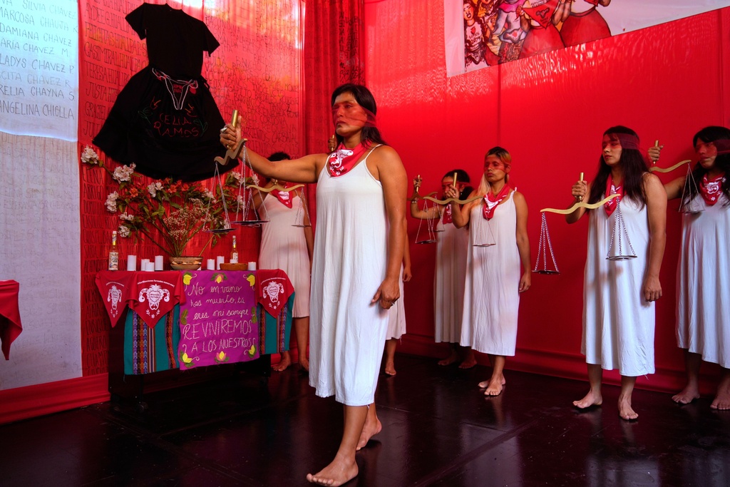 Demonstrators perform representing the female victims of a forced sterilization program under the administration of late Peruvian President Alberto Fujimori in Lima, Peru, Friday, March 6, 2026. (AP Photo/Martin Mejia)