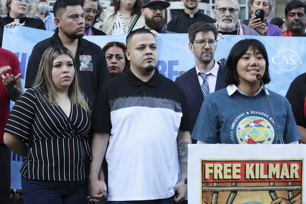 Jennifer Vasquez Sura, front left, wife of Kilmar Abrego Garcia, attends a protest rally at the Immigration and Customs Enforcement field office in Baltimore, Monday, Aug. 25, 2025, to support Kilmar Abrego Garcia. (AP Photo/KT Kanazawich)