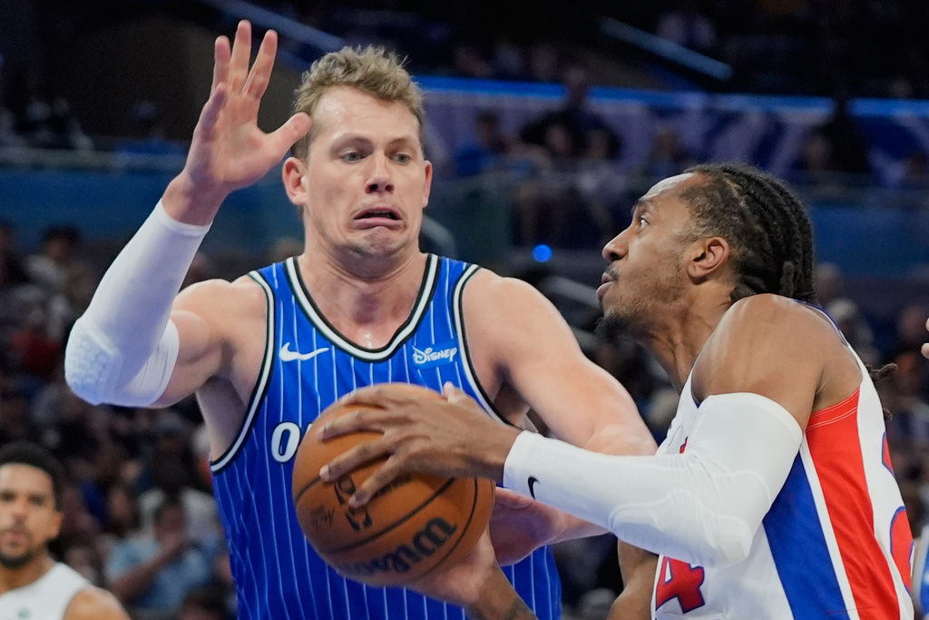Detroit Pistons guard Daniss Jenkins, right, looks to shoot against Orlando Magic forward Moritz Wagner, left during the first half of an NBA basketball game, Sunday, March 1, 2026, in Orlando, Fla. (AP Photo/John Raoux)