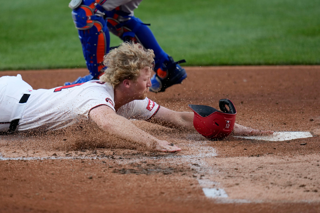 Washington Nationals' Joey Wiemer slides into home plate as he scores against the New York Mets on a double hit by José Tena during the second inning of a baseball game, Monday, May 18, 2026, in Washington. (AP Photo/Jess Rapfogel)