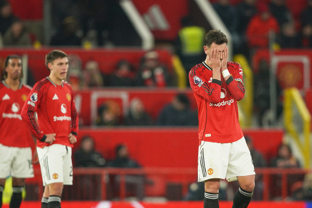 Manchester United's Bruno Fernandes, right, reacts after West Ham's Soungoutou Magassa scored his side's first goal during the English Premier League soccer match between Manchester United and West Ham United in Manchester, England, Thursday, Dec. 4, 2025. (AP Photo/Ian Hodgson)