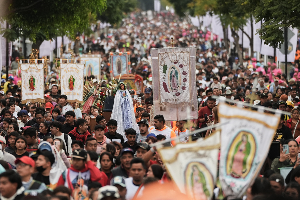Pilgrims arrive at Our Lady of Guadalupe Basilica in Mexico City, Thursday, Dec. 11, 2025, the day before her feast day. (AP Photo/Claudia Rosel)