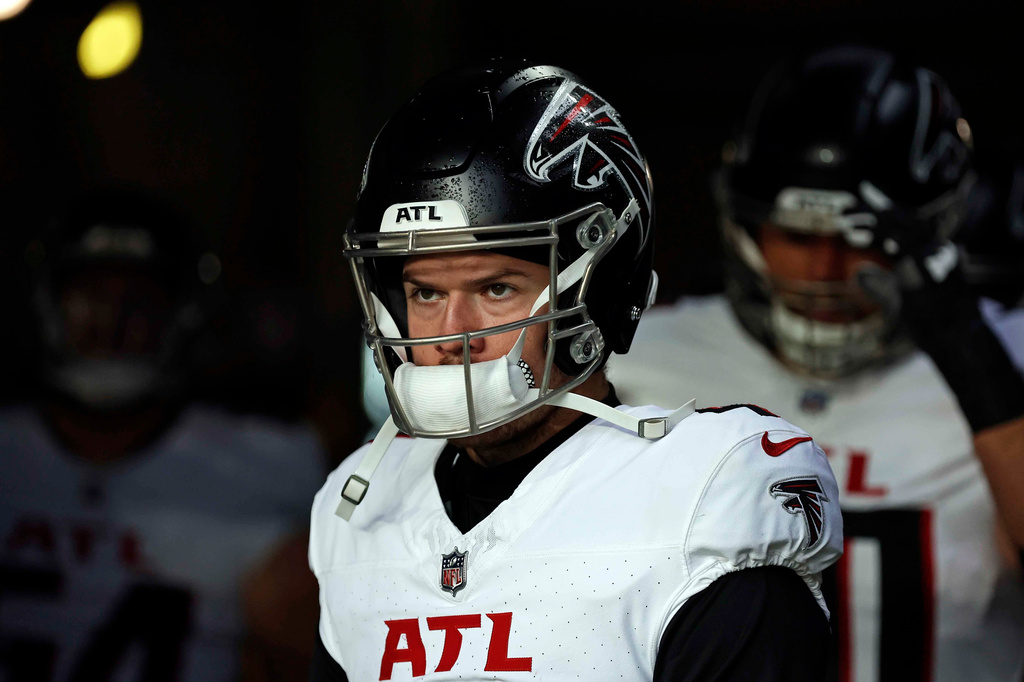 FILE - Atlanta Falcons quarterback Taylor Heinicke (4) takes the field to face the New York Jets in an NFL football game Dec. 3, 2023, in East Rutherford, N.J. (AP Photo/Adam Hunger, File)
