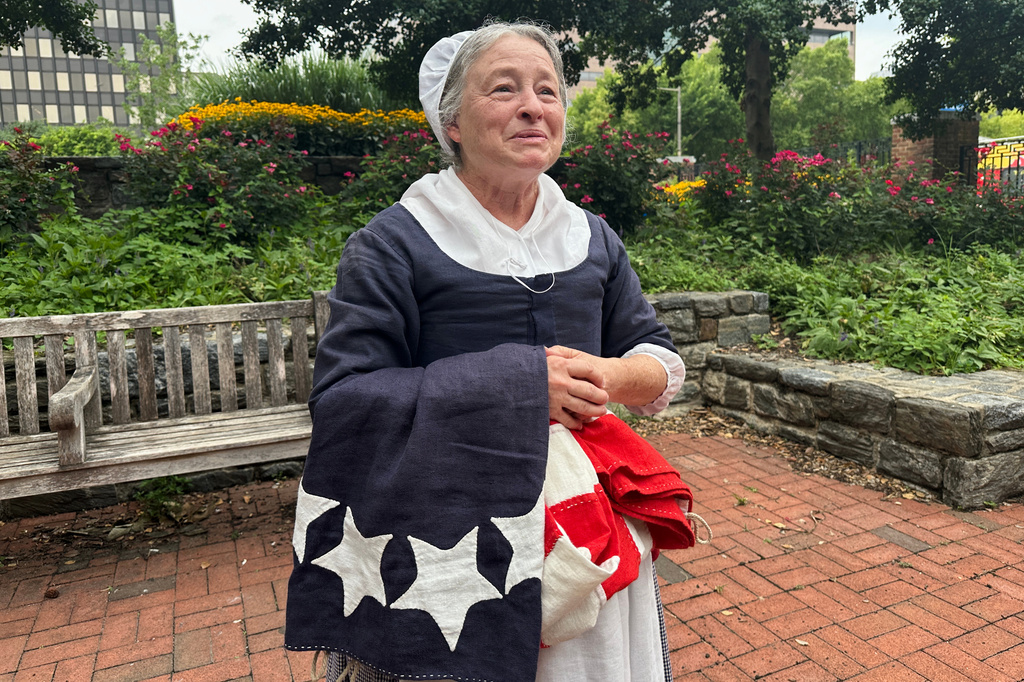 Carol Spacht, an actor from Historic Philadelphia, poses for a photo in her Betsy Ross costume in Philadelphia on July 28, 2026. (AP Photo/Tassanee Vejpongsa)