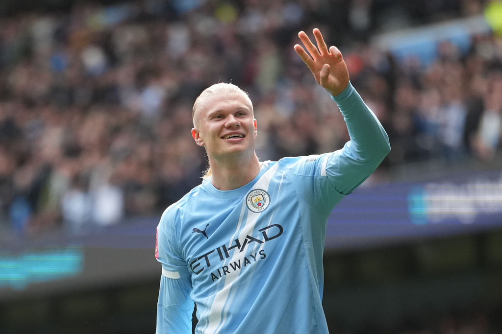 Manchester City's Erling Haaland celebrates after scoring his third goal during the FA Cup quarter-final soccer match between Manchester City and Liverpool in Manchester, England, Saturday, April 4, 2026. (AP Photo/Jon Super)