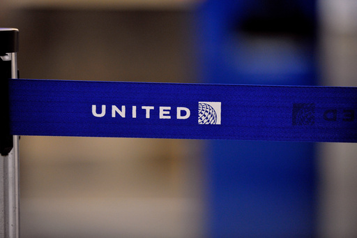 FILE - The United Airlines logo can be seen on a rope line at O'Hare International Airport, May 17, 2011. (AP Photo/Brian Kersey, File) FILE - The United Airlines logo can be seen on a rope line at O'Hare International Airport, May 17, 2011. (AP Photo/Brian Kersey, File)