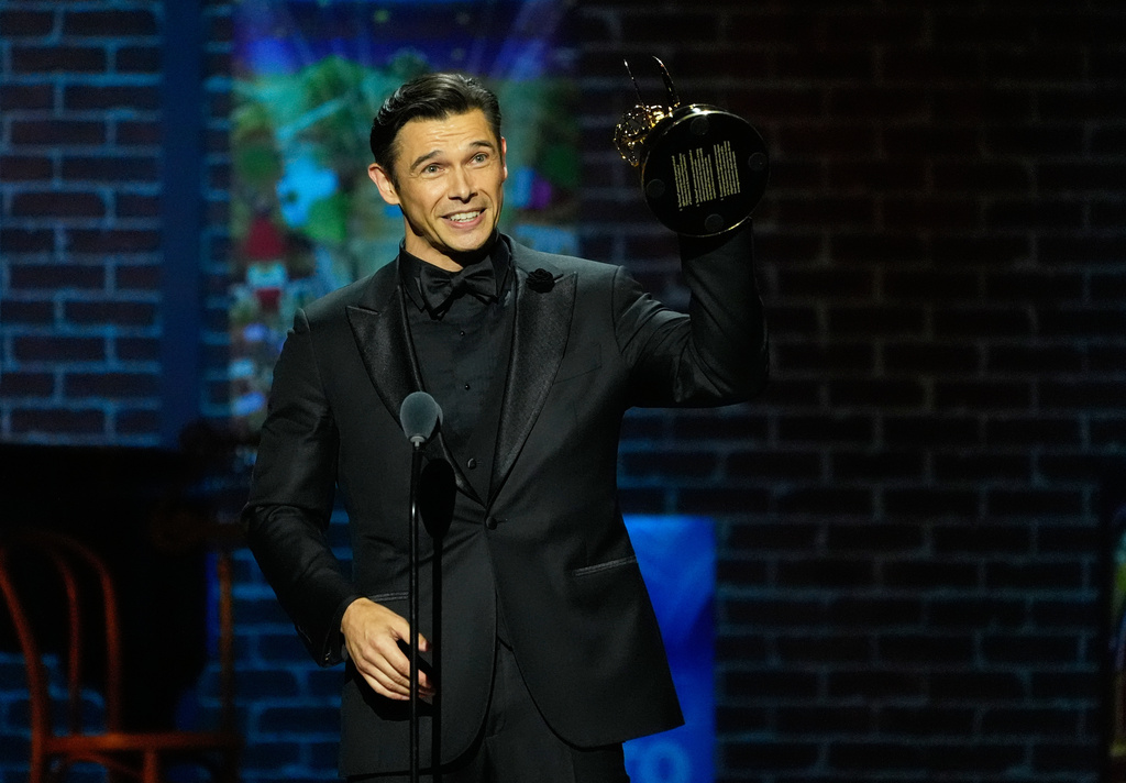 Paul Telfer accepts the Outstanding Lead Actor in a Daytime Drama Series award for his performance in "Days of Our Lives" during the 52nd Annual Daytime Emmy Awards on Friday, Oct. 17, 2025, at Pasadena Civic Auditorium in Pasadena, Calif. (AP Photo/Chris Pizzello)