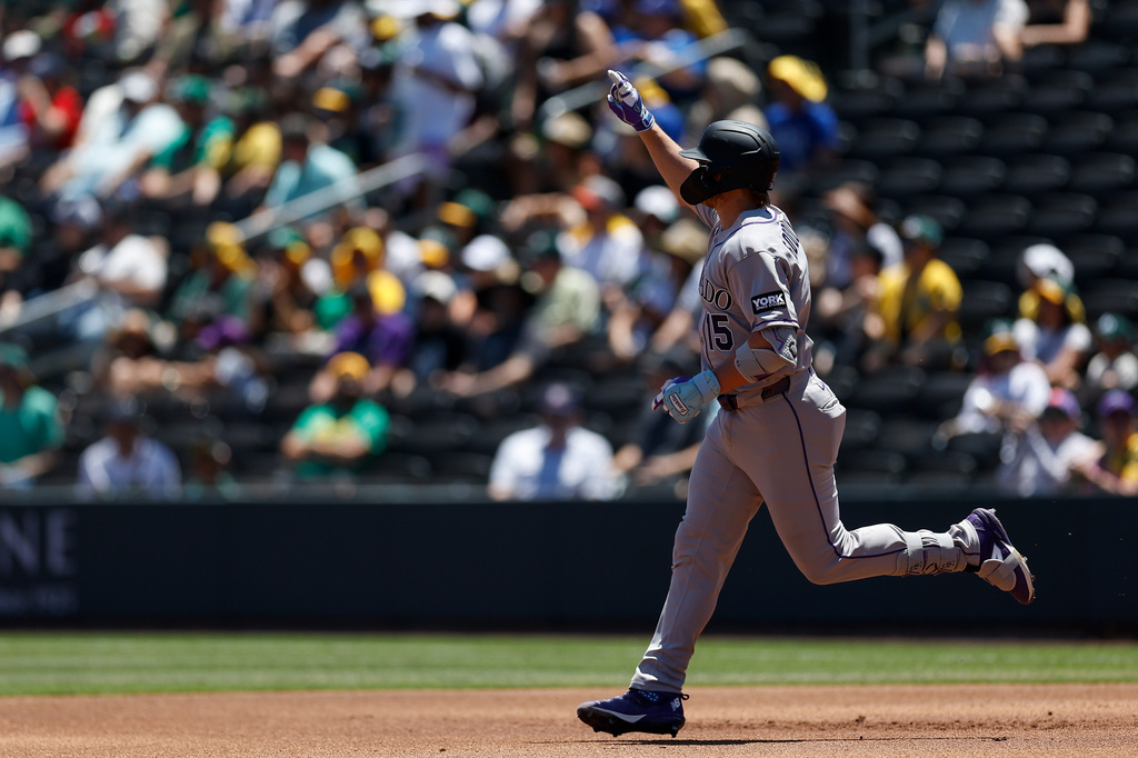 Colorado Rockies' Hunter Goodman rounds the bases after hitting a two-run home run during the first inning of a baseball game against the Athletics, Sunday, June 14, 2026, in Las Vegas. (AP Photo/Caroline Brehman)