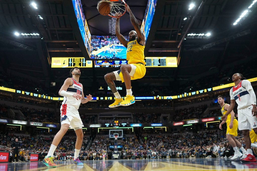 Indiana Pacers forward Isaiah Jackson dunks in front of Washington Wizards forward Tristan Vukcevic (00) during the first half of an NBA Cup basketball game in Indianapolis, Friday, Nov. 28, 2025. (AP Photo/AJ Mast)