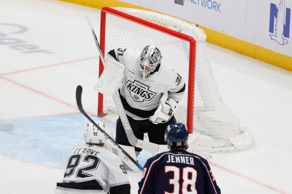 Los Angeles Kings' Anton Forsberg, top, makes a save against the Columbus Blue Jackets during the third period of an NHL hockey game, Monday, March 9, 2026, in Columbus, Ohio. (AP Photo/Jay LaPrete)