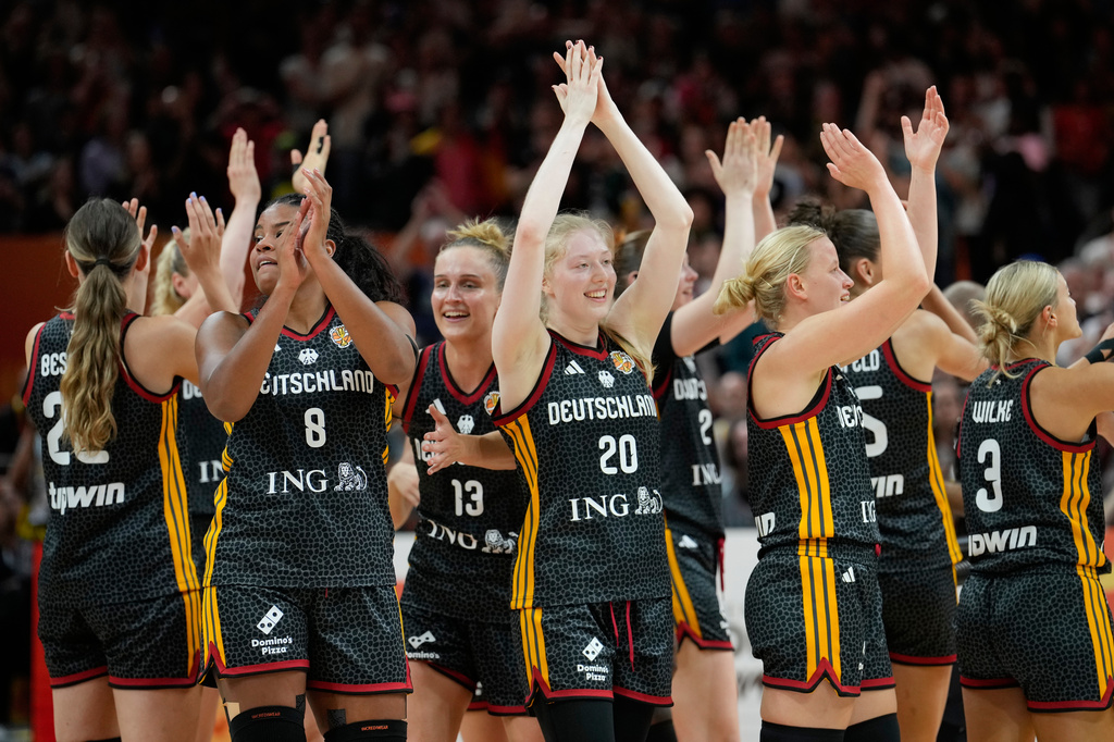 German players celebrate after the Women's Basketball World Cup quarterfinal match between Germany and Belgium in Berlin, Thursday, Sept. 10, 2026. (AP Photo/Ebrahim Noroozi)