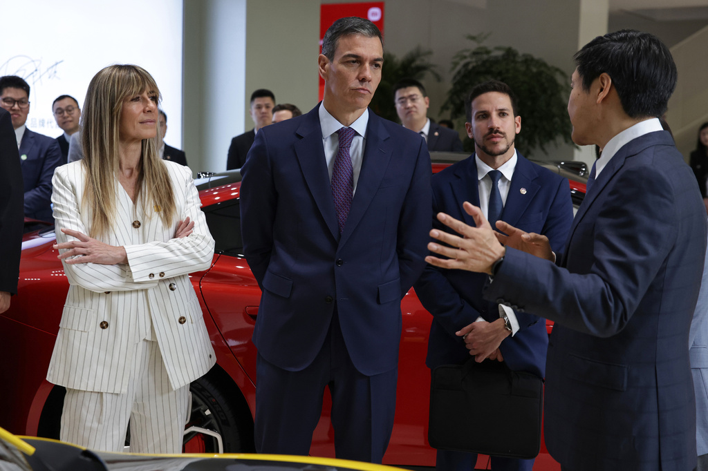 Xiaomi founder Lei Jun, right, speaks to Spanish Prime Minister Pedro Sanchez, center, and his wife Begona Gomez at the Xiaomi headquarters in Beijing, Monday, April 13, 2026. (Andres Martinez Casares/Pool Photo via AP)