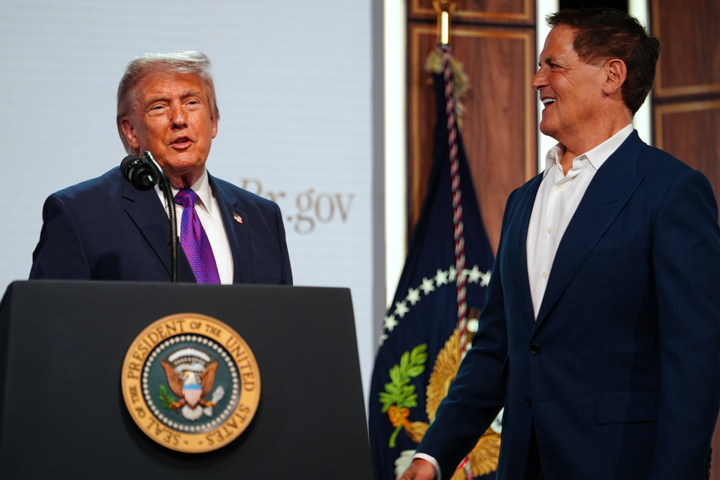 President Donald Trump shakes hands with Mark Cuban of Cost Plus Drugs, as he speaks about prescription drug prices in the South Court Auditorium in the Eisenhower Executive Office Building on the White House campus, Monday, May 18, 2026, in Washington. (AP Photo/Julia Demaree Nikhinson)