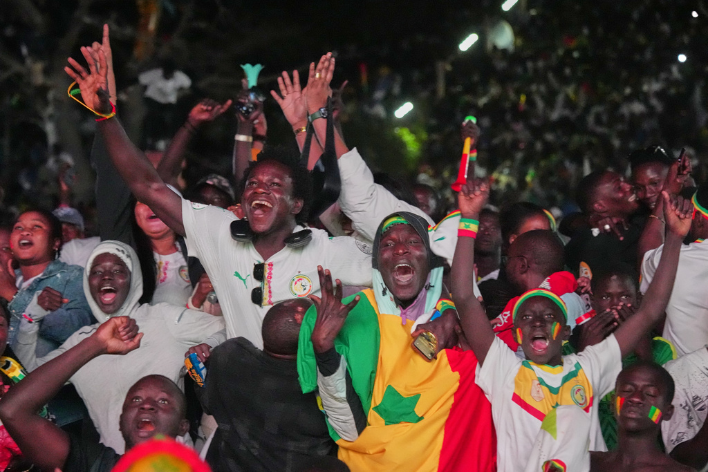 Fans celebrate Senegal's goal in the Africa Cup of Nations final soccer match between Senegal and Morocco in Dakar, Senegal, Sunday, Jan. 18, 2026. (AP Photo/Misper Apawu)