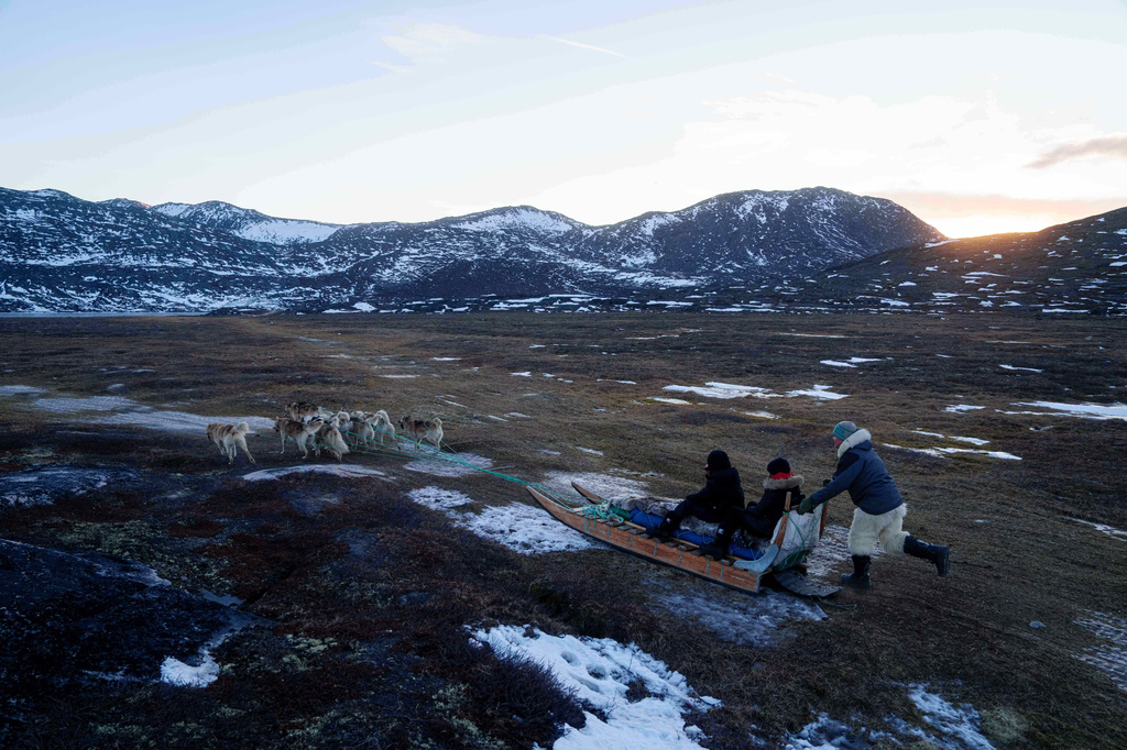 FILE - Jørgen Kristensen rides with his sled dogs in Ilulissat, Greenland, Jan. 27, 2026. (AP Photo/Evgeniy Maloletka, File)
