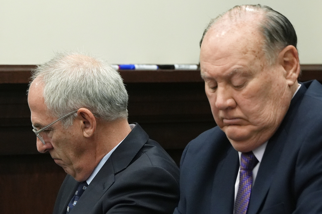 FILE - Ex-FirstEnergy Senior Vice President Michael Dowling and former FirstEnergy CEO Chuck Jones listen as Summit County Common Pleas Judge Susan Baker Ross rereads a portion of the jury instructions to the jury during in their case in Akron, Ohio, March 26, 2026. (Mike Cardew /Akron Beacon Journal via AP, Pool, File)