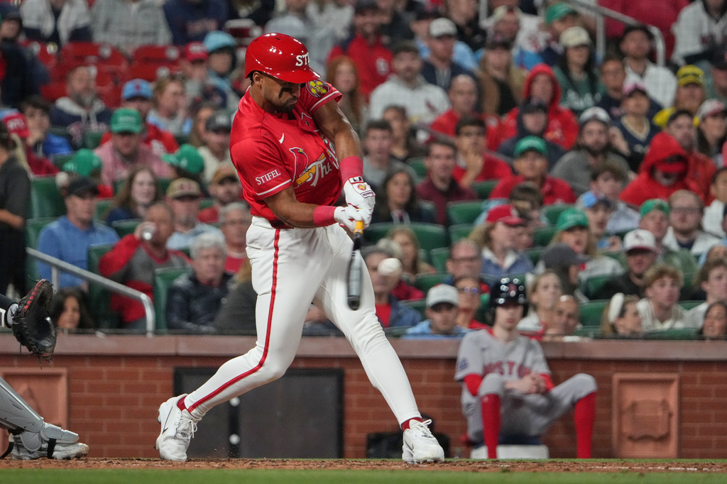 St. Louis Cardinals' Jose Fermin hits a sacrifice fly to score Ramon Urias during the fifth inning of a baseball game against the Boston Red Sox Friday, April 10, 2026, in St. Louis. (AP Photo/Jeff Roberson)