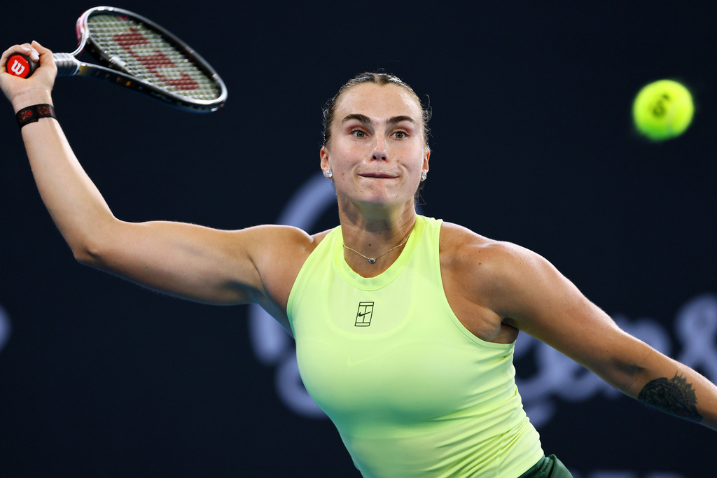 Aryna Sabalenka of Belarus plays a shot during the women's final match against Marta Kostyuk of Ukraine at the Brisbane International tennis tournament in Brisbane, Australia, Sunday, Jan. 11, 2026. (AP Photo/Tertius Pickard)