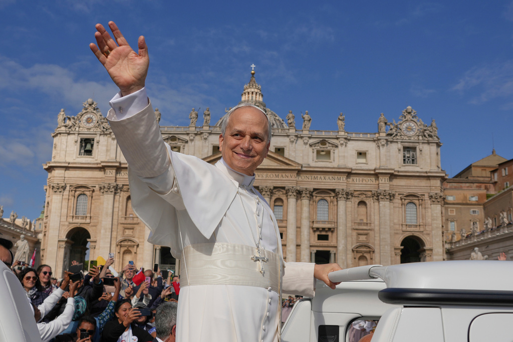 FILE - Pope Leo XIV on his popemobile tours St. Peter's Square at the Vatican prior to the inaugural Mass of his pontificate, May 18, 2025. (AP Photo/Andrew Medichini, File)
