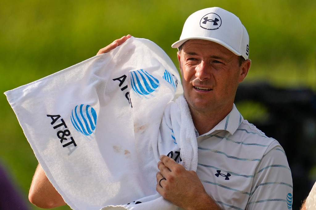 Jordan Spieth uses a towel to wipe his face during the first round of the St. Jude Championship golf tournament Thursday, Aug. 13, 2026, in Memphis, Tenn. (AP Photo/George Walker IV)