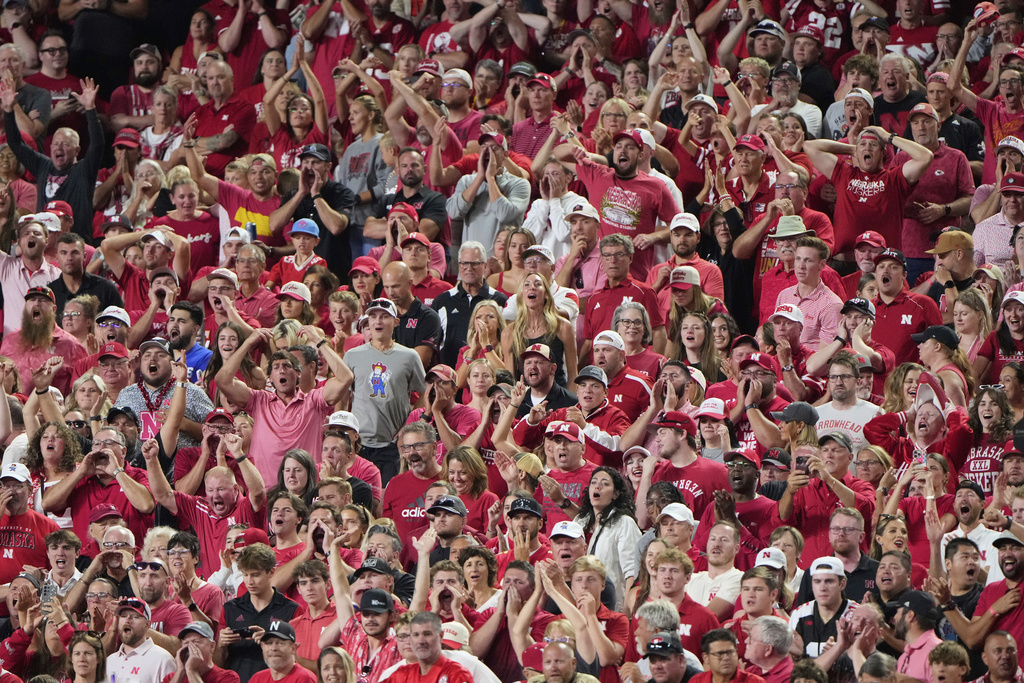 Fans cheer during the second half of an NCAA college football game between Cincinnati and Nebraska Thursday, Aug. 28, 2025, at Arrowhead Stadium in Kansas City, Mo. (AP Photo/Charlie Riedel)