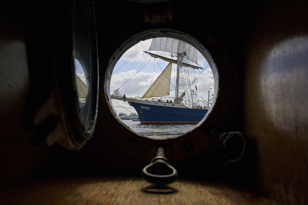 The barkentine Antigua passes as hundreds of tall ships sailed into the Dutch capital's harbor for the 10th edition of SAIL, in Amsterdam, Netherlands, Wednesday, Aug. 20, 2025. (AP Photo/Peter Dejong)