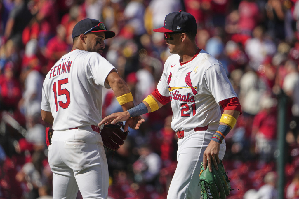 St. Louis Cardinals' Lars Nootbaar (21) and Jose Fermin (15) celebrate a victory over the San Francisco Giants in a baseball game Sunday, Sept. 7, 2025, in St. Louis. (AP Photo/Jeff Roberson)