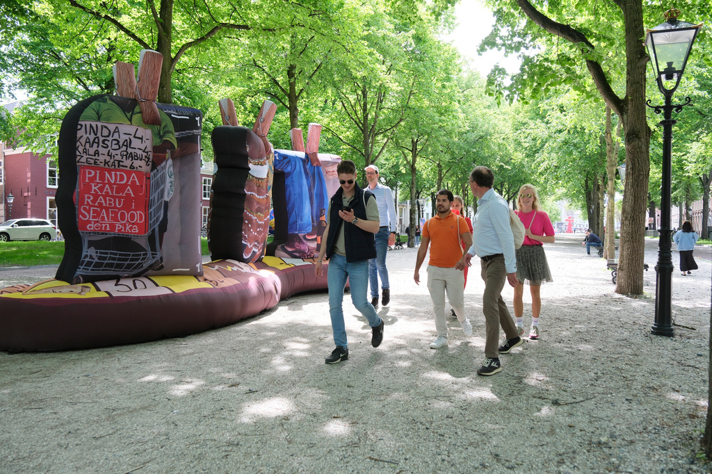 Peope walk by an art installation titled Koncha pa dilanti by Eugenie Boon as part of the BlowUp Jubilee Art walk in the Hague, Netherlands, Thursday, May 21, 2026. (AP Photo/Patrick Post)
