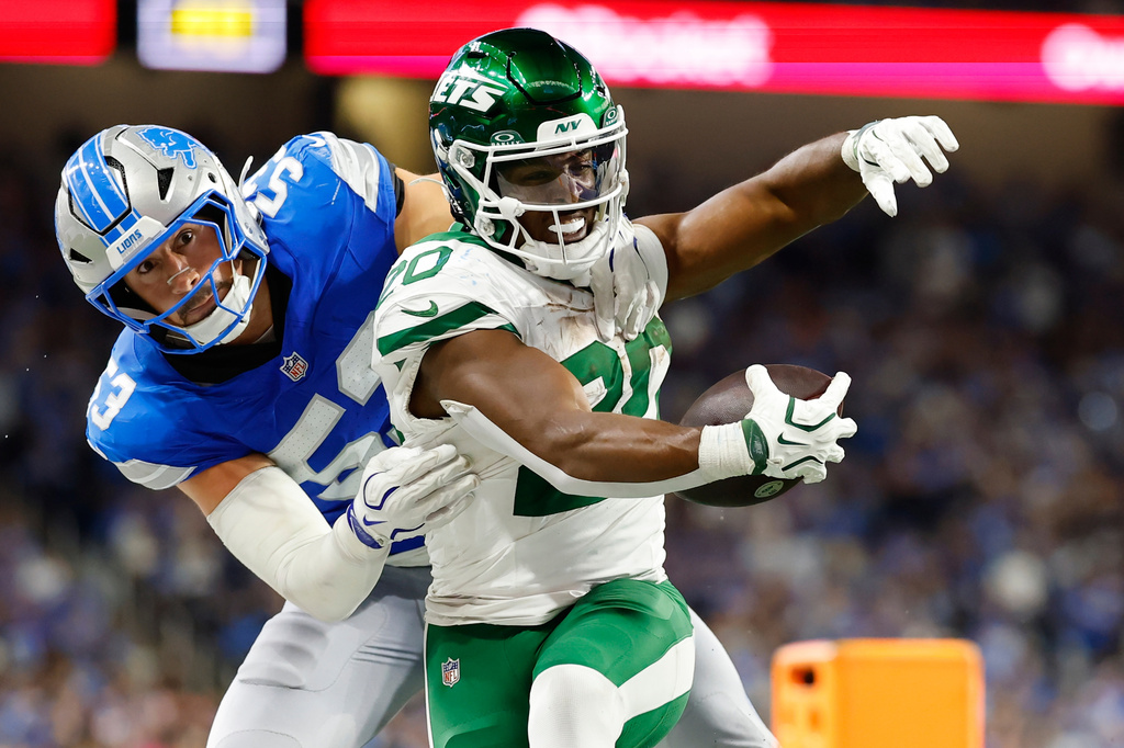 Detroit Lions' Trevor Nowaske stops New York Jets' Breece Hall during the second half of an NFL football game in Detroit, Sunday, Sept. 27, 2026. (AP Photo/Rey Del Rio)