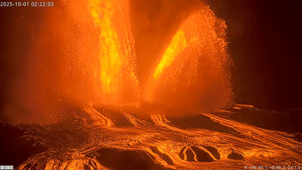 This image from webcam footage provided by the United States Geological Survey (USGS) shows lava fountains shooting up in the air in the latest episode of an ongoing eruption of Kilauea volcano inside Hawaii Volcanoes National Park on Wednesday, Oct. 1, 2025, in Hawaii. (U.S. Geological Survey via AP)