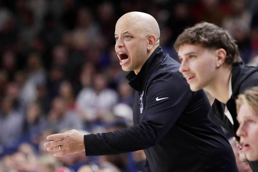 Portland head coach Shantay Legans, center, directs his team during the first half of an NCAA college basketball game against Gonzaga Wednesday, Feb. 25, 2026, in Spokane, Wash. (AP Photo/Young Kwak)