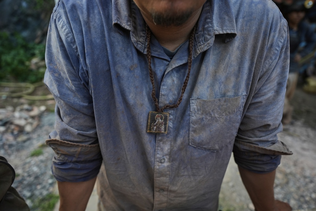 Hugo Flores takes a break after a day's work mining for mercury in San Joaquin, Mexico, Tuesday, Aug. 19, 2025. (AP Photo/Fernando Llano)