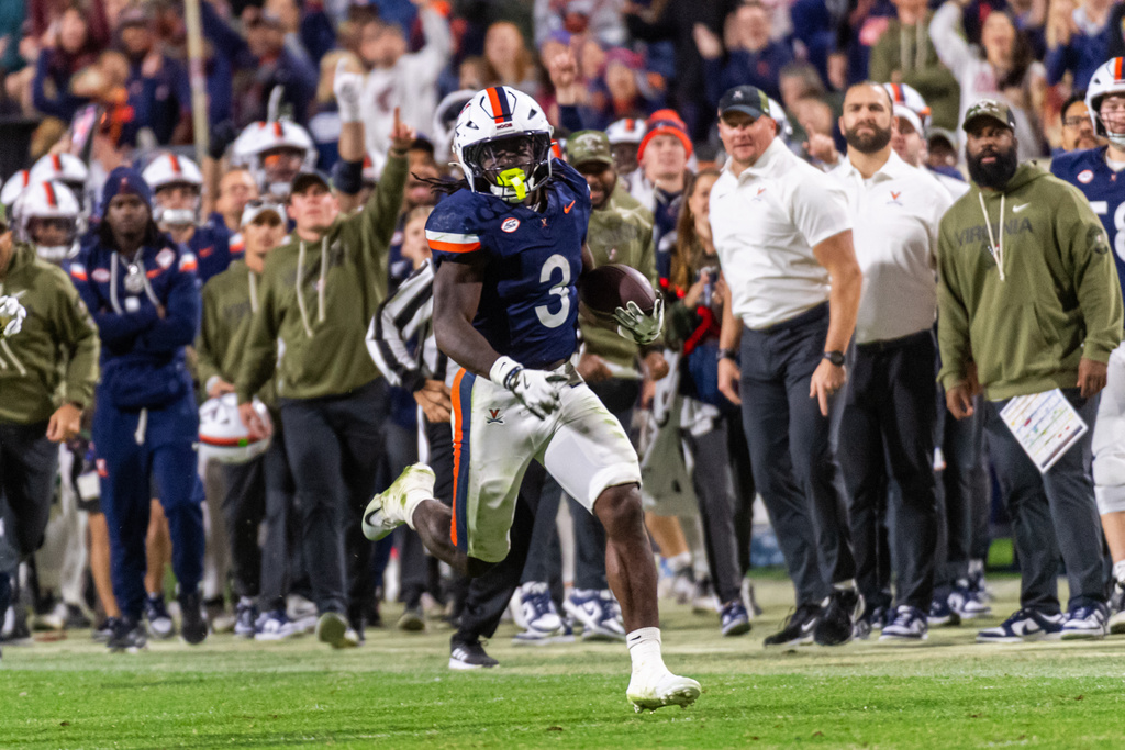 Virginia running back J'Mari Taylor (3) runs for a big gain against Wake Forest during the second half of an NCAA college football game, Saturday, Oct. 4, 2025, in Charlottesville, Va. (AP Photo/Robert Simmons)