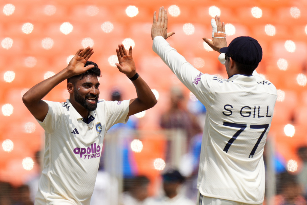 India's Mohammed Siraj, left, celebrates with India's captain Shubman Gill after the dismissal of West Indies' Justin Greaves on the third day of the first Test cricket match between India and West Indies at Narendra Modi Stadium in Ahmedabad, India, Saturday, Oct. 4, 2025. (AP Photo/Ajit Solanki)