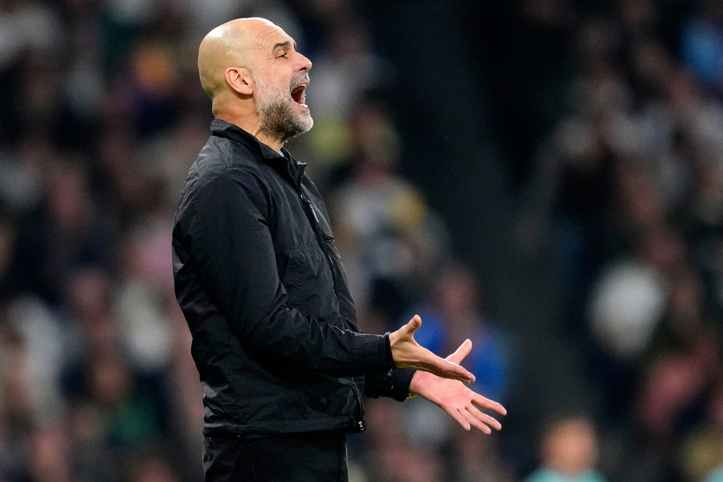Manchester City's head coach Pep Guardiola reacts during a first leg round of 16 Champions League soccer match between Real Madrid and Manchester City in Madrid, Spain, Wednesday, March 11, 2026. ((AP Photo/Jose Breton)